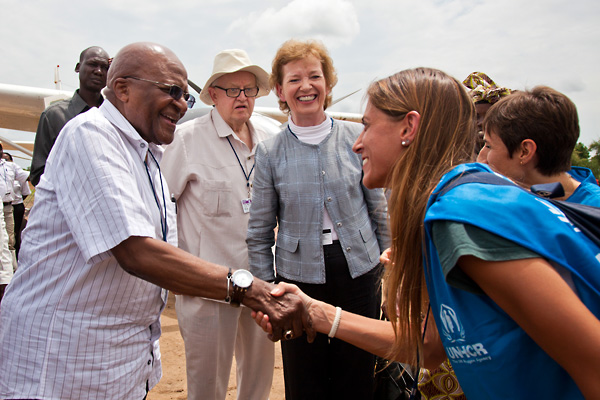 Desmond Tutu and fellow Elders with UNHCR aid workers in Yusuf Batil refugee camp, July 2012.