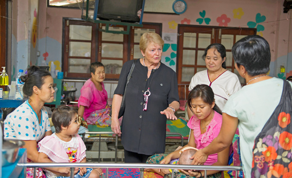 Gro Harlem Brundtland speaks with patients and their families at Mae Tao Clinic